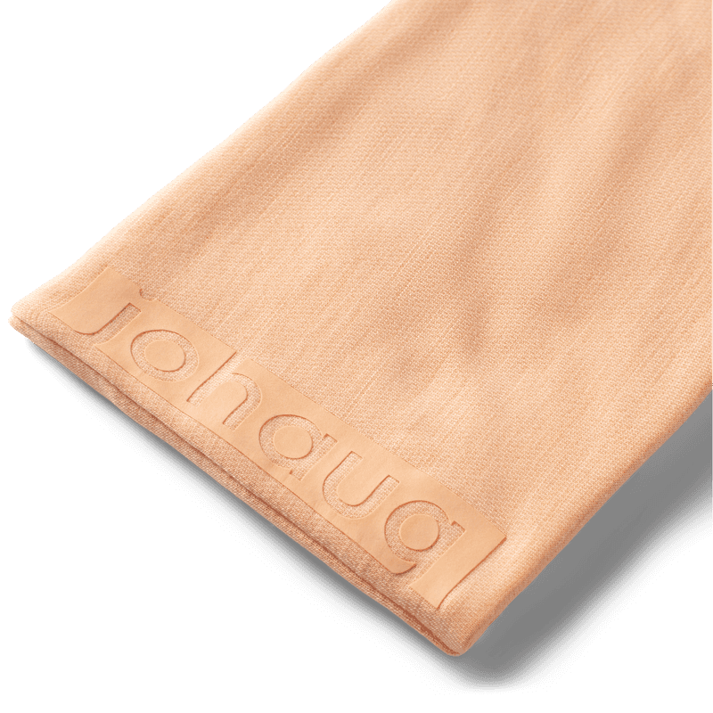 Johaug Aerial Woolmix Headband in Cream – close-up of soft wool blend fabric with Johaug logo