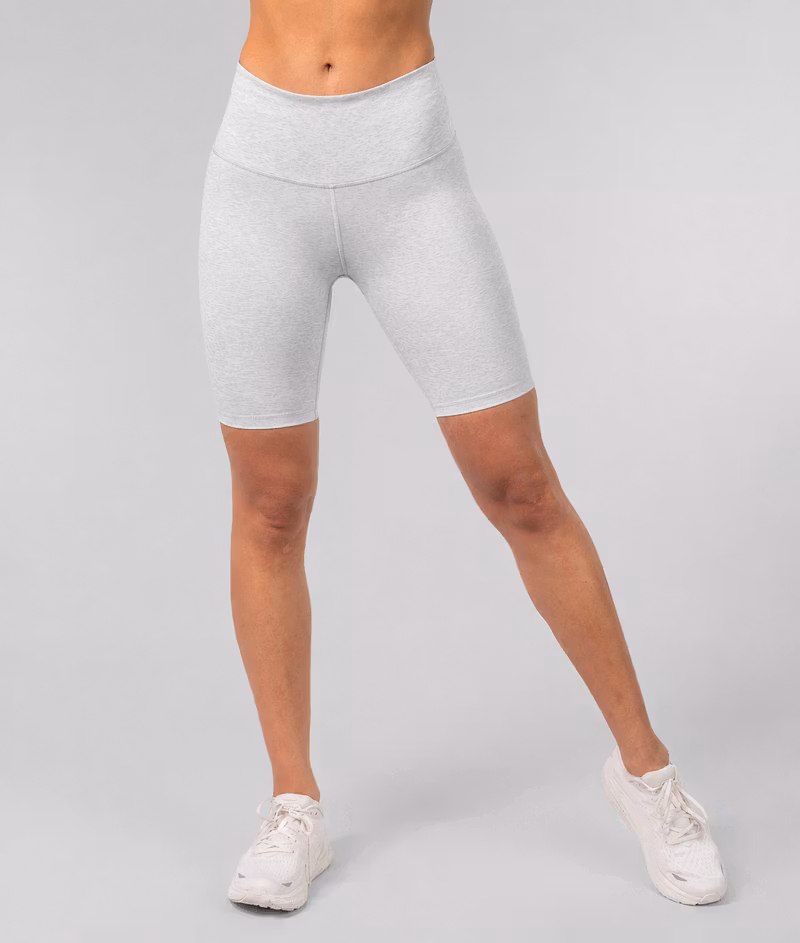 Woman wearing gray Johaug cycling shorts, front view from waist down, against a light gray background