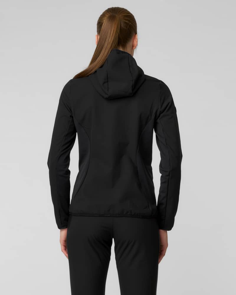 Back view of a woman wearing a black hooded jacket