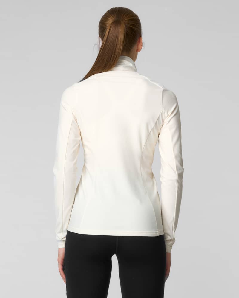 Back view of a woman wearing an ivory quarter-zip fleece sweater