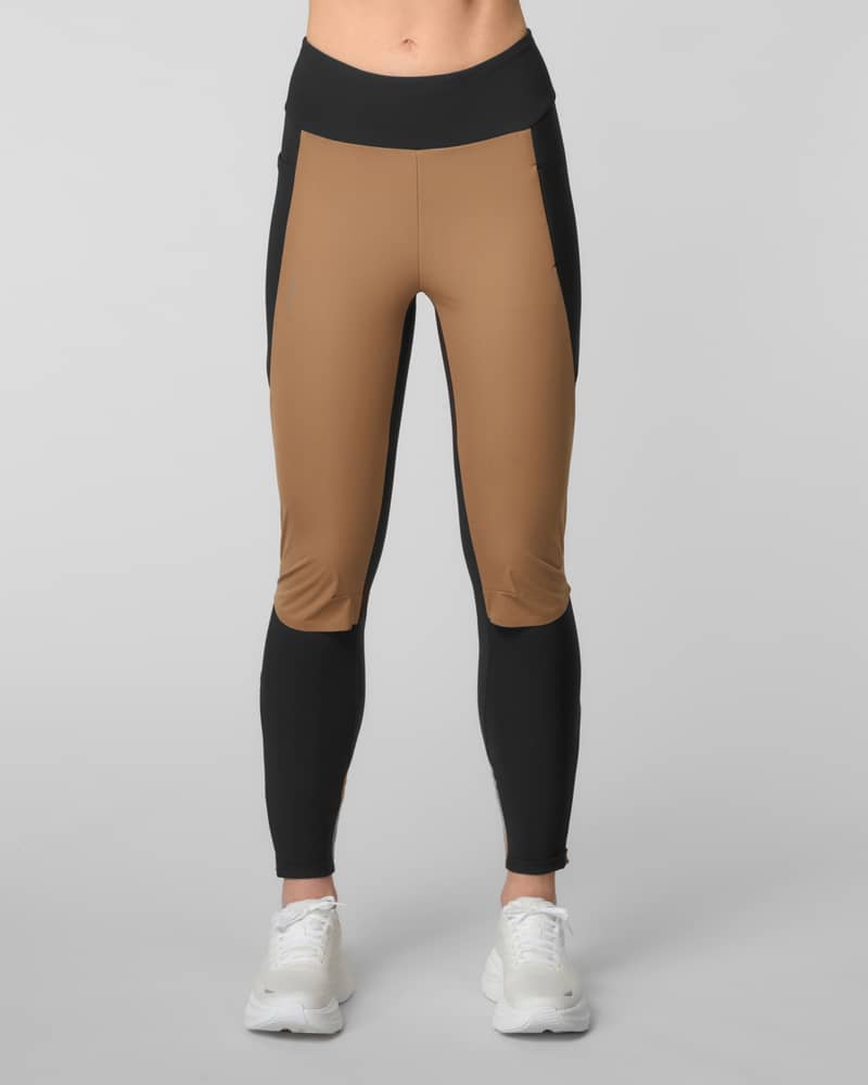 Front view of camel and black color-blocked running leggings