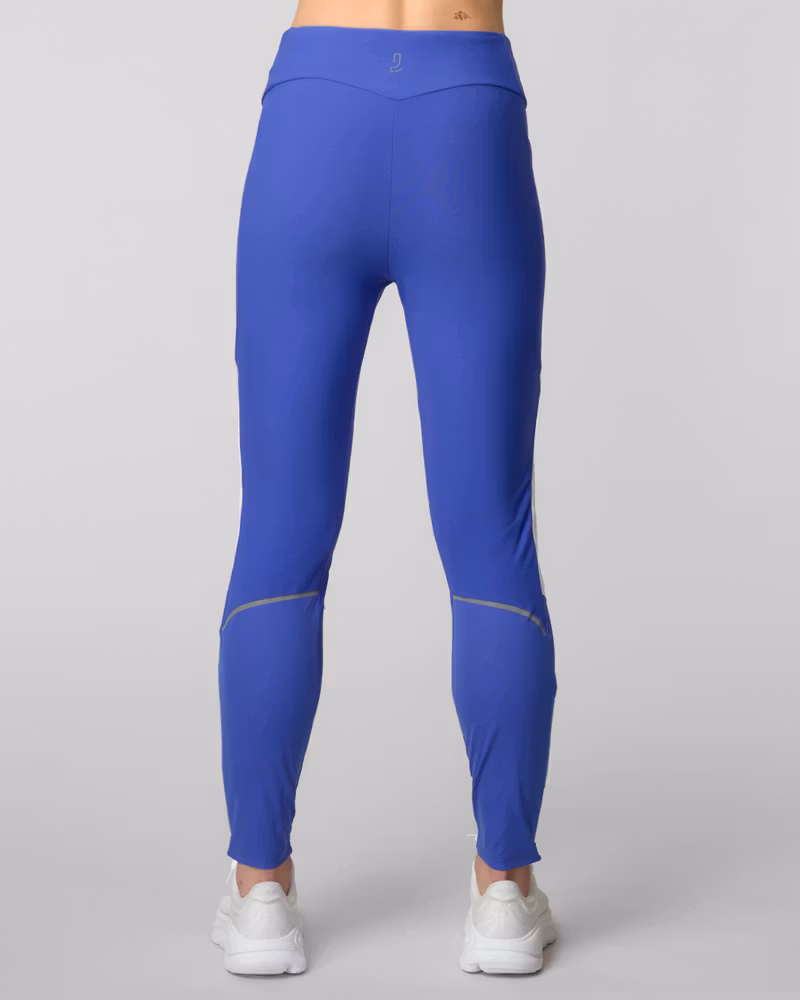 Back view of blue running leggings with reflective knee stripes